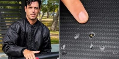 Dave Seymour toont tandafdrukken van een haai op zijn beschadigde e-foilboard